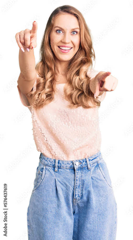 Young beautiful caucasian woman with blond hair wearing casual clothes pointing to you and the camera with fingers, smiling positive and cheerful Young beautiful caucasian woman with blond hair wearing casual clothes pointing to you and the camera with fingers, smiling positive and cheerful
