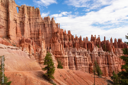 Close up scenic view of the wall of windows on Peekaboo hiking trail in Bryce Canyon National Park, Utah, USA. Massive steep hoodoo sandstone rock formations in natural amphitheatre in sunny summer