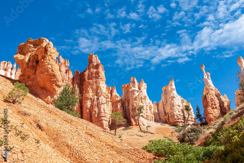 Close up scenic view of impressive Winy Pinnacles on Peekaboo hiking trail in Bryce Canyon National Park, Utah, USA. Massive steep hoodoo sandstone rock formations in natural amphitheatre in summer