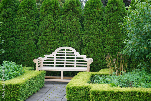 green meetingpoint with wooden bench photo