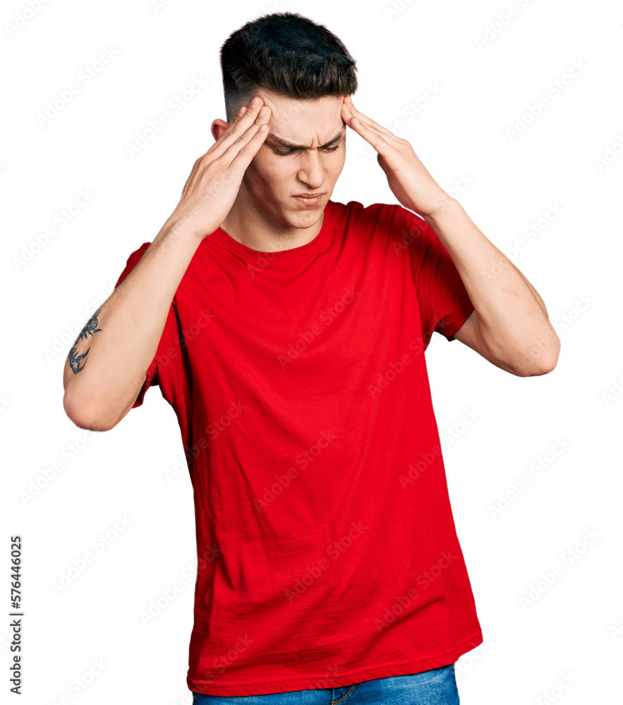 Young caucasian boy with ears dilation wearing casual red t shirt with hand on head, headache because stress. suffering migraine. Young caucasian boy with ears dilation wearing casual red t shirt with hand on head, headache because stress. suffering migraine.