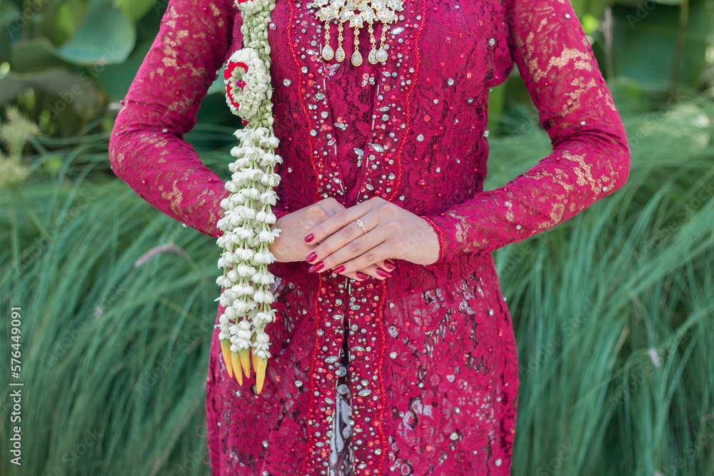 Indonesian wedding accessories. A female model who wears makeup and a