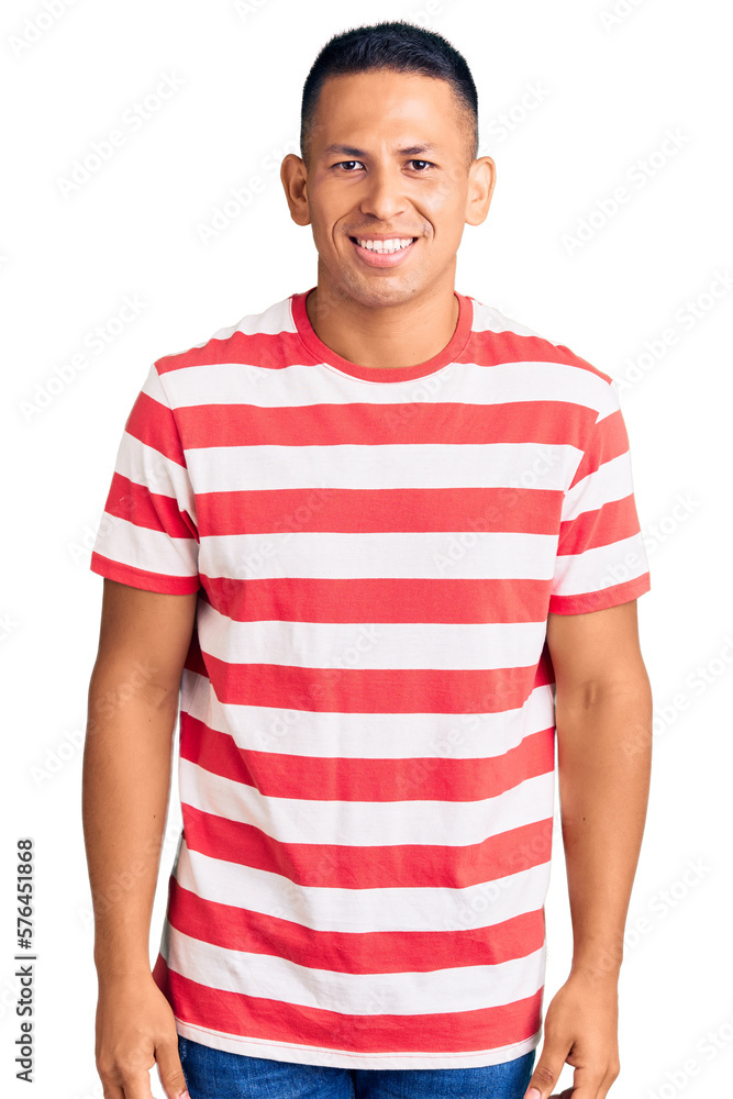 Young handsome latin man wearing casual clothes with a happy and cool smile on face. lucky person. Young handsome latin man wearing casual clothes with a happy and cool smile on face. lucky person.