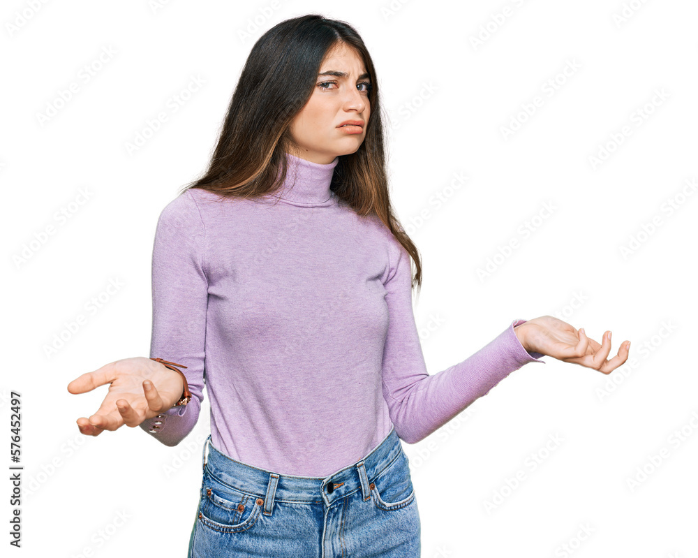 Young beautiful teen girl wearing turtleneck sweater clueless and confused with open arms, no idea concept. Young beautiful teen girl wearing turtleneck sweater clueless and confused with open arms, no idea concept.