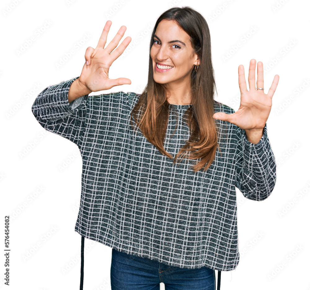 Young beautiful woman wearing casual clothes showing and pointing up with fingers number nine while smiling confident and happy. Young beautiful woman wearing casual clothes showing and pointing up with fingers number nine while smiling confident and happy.