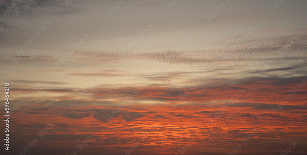 Fototapeta premium Sunset sky. Abstract nature background. Dramatic blue with orange colorful clouds in twilight time.