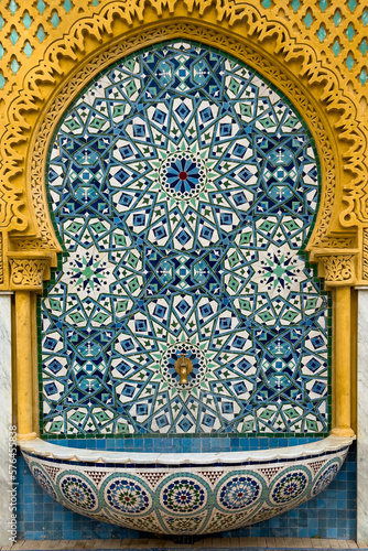 Traditional Moroccan wall fountain in a Jnan Sbil Gardens in Fez photo