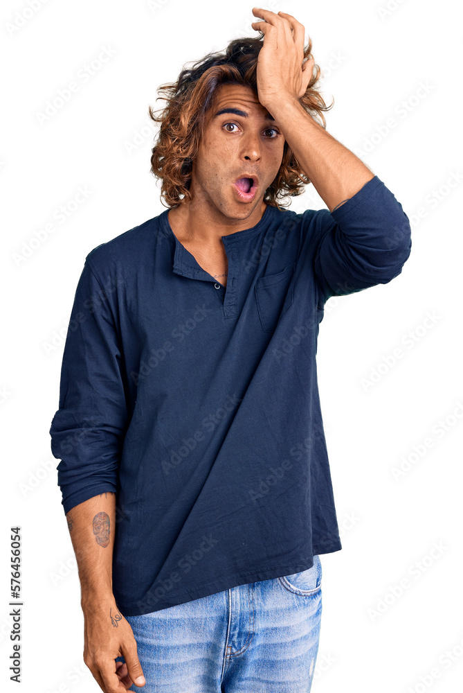 Young hispanic man wearing casual clothes surprised with hand on head for mistake, remember error. forgot, bad memory concept. Young hispanic man wearing casual clothes surprised with hand on head for mistake, remember error. forgot, bad memory concept.