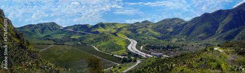 Aerial Panoramic 101 Ventura Highway in Southern California winding through green hills and valleys from Thousand Oaks to Northern California