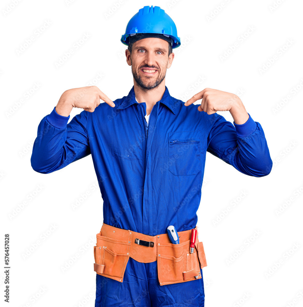 Young handsome man wearing worker uniform and hardhat looking confident with smile on face, pointing oneself with fingers proud and happy. Young handsome man wearing worker uniform and hardhat looking confident with smile on face, pointing oneself with fingers proud and happy.