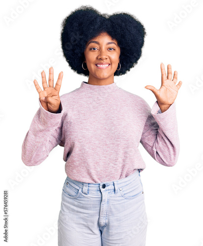 Young african american girl wearing casual clothes showing and pointing up with fingers number nine while smiling confident and happy.