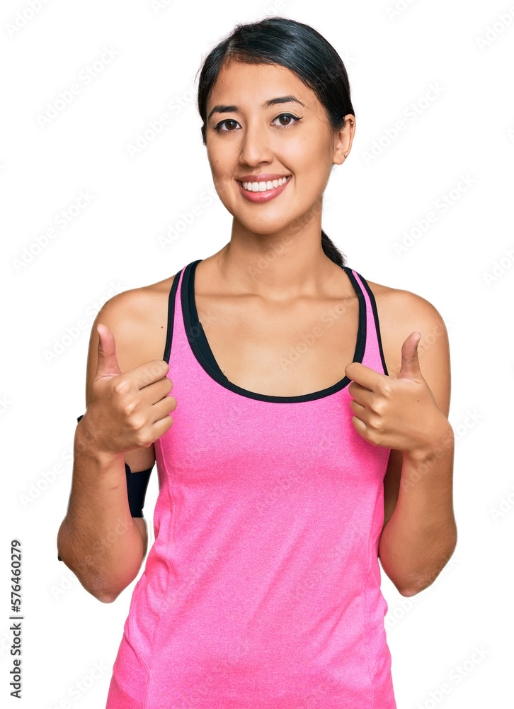 Beautiful asian young sport woman wearing sportswear and arm band success sign doing positive gesture with hand, thumbs up smiling and happy. cheerful expression and winner gesture. Beautiful asian young sport woman wearing sportswear and arm band success sign doing positive gesture with hand, thumbs up smiling and happy. cheerful expression and winner gesture.