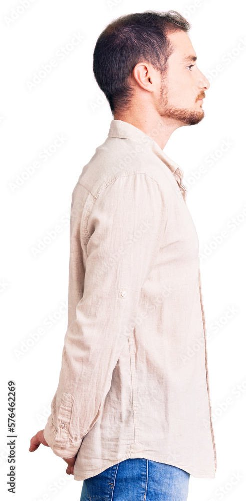 Young handsome caucasian man wearing casual clothes looking to side, relax profile pose with natural face with confident smile. Young handsome caucasian man wearing casual clothes looking to side, relax profile pose with natural face with confident smile.
