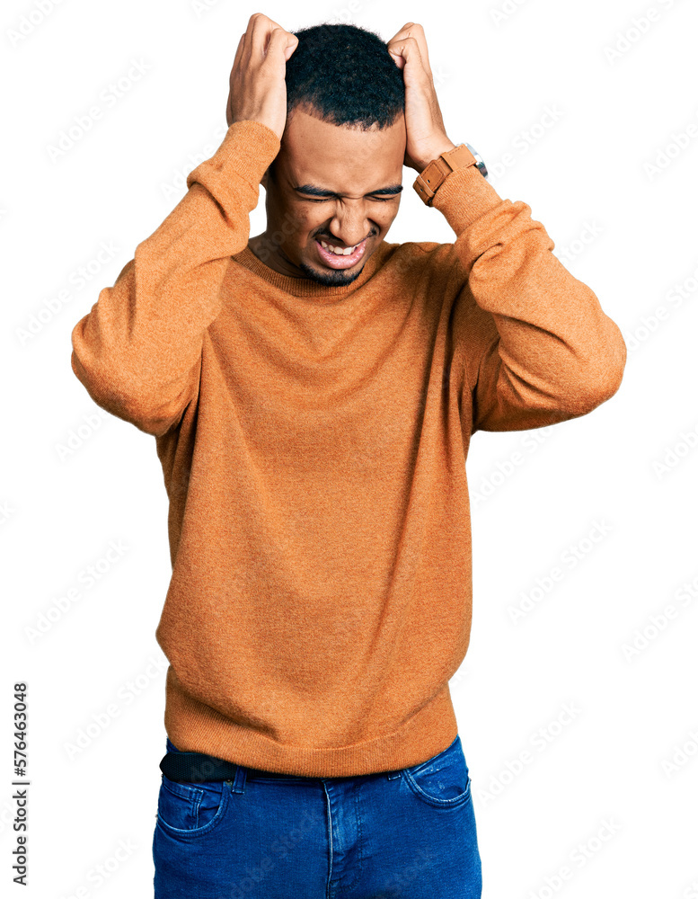 Young african american man wearing casual clothes suffering from headache desperate and stressed because pain and migraine. hands on head. Young african american man wearing casual clothes suffering from headache desperate and stressed because pain and migraine. hands on head.