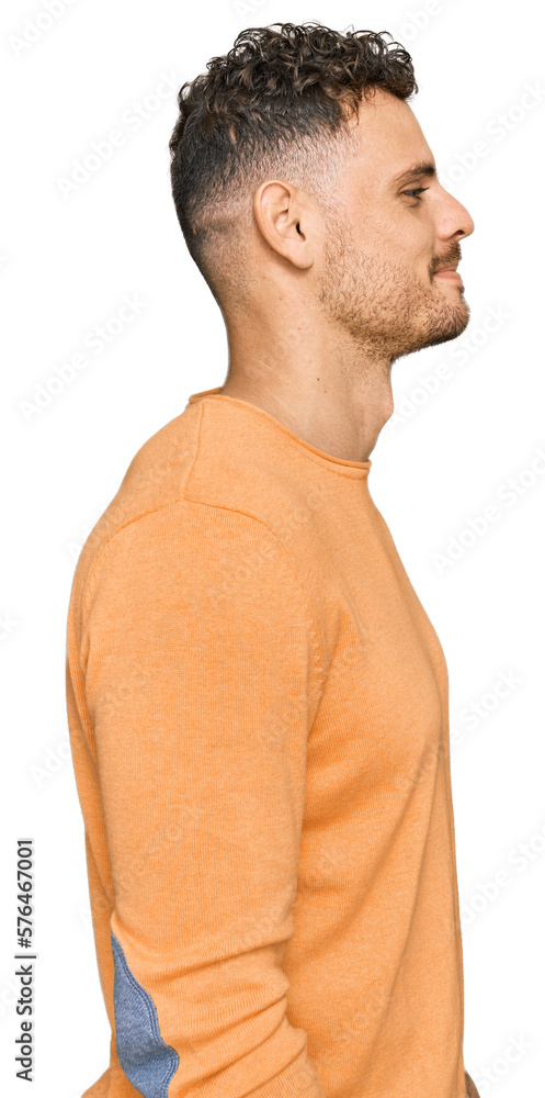 Young hispanic man wearing casual clothes looking to side, relax profile pose with natural face with confident smile. Young hispanic man wearing casual clothes looking to side, relax profile pose with natural face with confident smile.