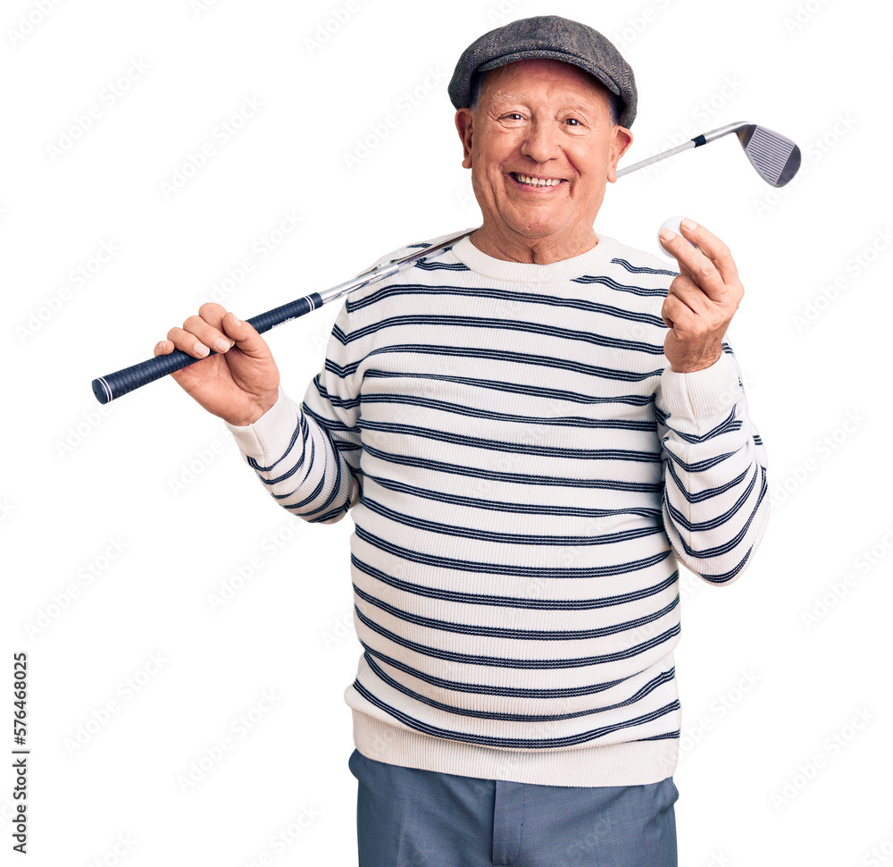 Senior handsome grey-haired man holding golf club and ball looking positive and happy standing and smiling with a confident smile showing teeth Senior handsome grey-haired man holding golf club and ball looking positive and happy standing and smiling with a confident smile showing teeth