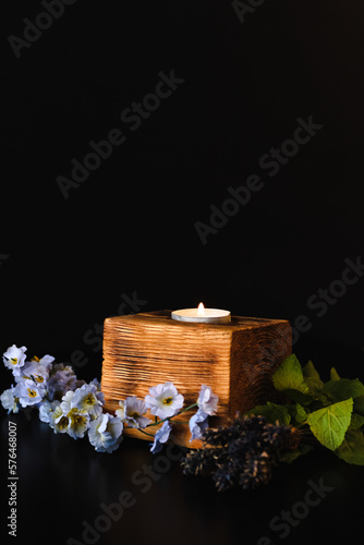 Soothing Scents: Aromatherapy Candle with Flowers and Mint
Rustic Elegance: Candlelit Centerpiece with Natural Accents
Tranquil Ambience: Aromatic Candle on a Wooden Plank with Botanicals