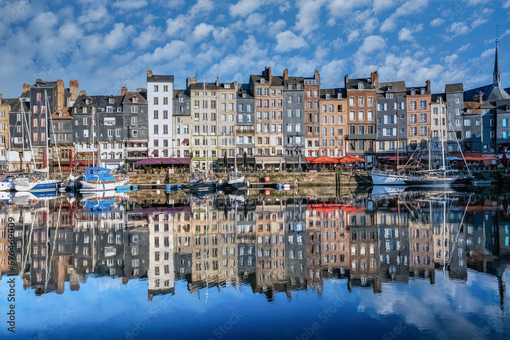 Honfleur, beautiful city in France, the harbor at sunrise, reflection on the river
