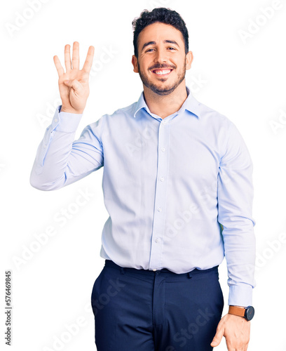 Young hispanic man wearing business clothes showing and pointing up with fingers number four while smiling confident and happy. © Krakenimages.com
