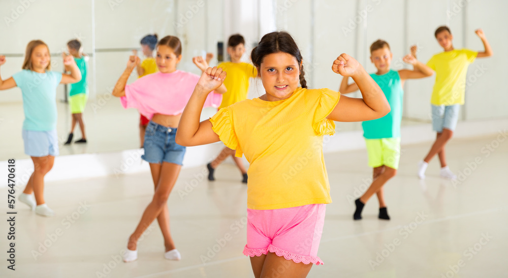 Dance studio - happy girls and boys in dance lesson