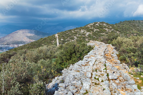 Ruins of old Roman Aqueduct. View Delikkemer Bridge at olive forest near Mediterranean sea coast. Near to Patara Ancient City at location Kalkan, Kas, Antalya. Popular travel destination in Turkey photo