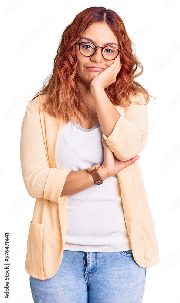 Young latin woman wearing business clothes thinking looking tired and bored with depression problems with crossed arms. Young latin woman wearing business clothes thinking looking tired and bored with depression problems with crossed arms.