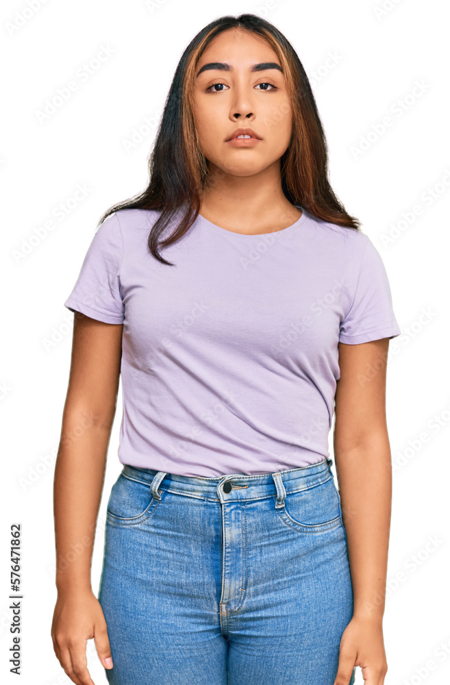 Obraz premium Young latin woman wearing casual clothes relaxed with serious expression on face. simple and natural looking at the camera.