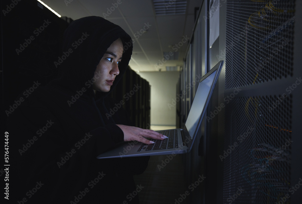 Hacker, server room and woman computer coding, data center crime and ransomware of cyberpunk in dark. Laptop hacking, person or thief in cybersecurity, information technology and criminal programmer Hacker, server room and woman computer coding, data center crime and ransomware of cyberpunk in dark. Laptop hacking, person or thief in cybersecurity, information technology and criminal programmer