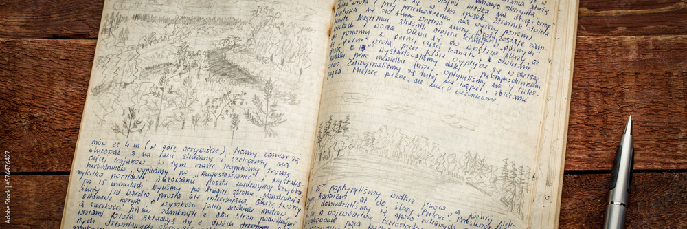 Kayak expedition journal - handwriting in Polish and drawing in pencil against rustic weathered wood.