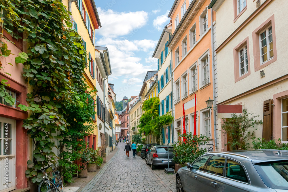 A picturesque narrow residential street in the Altstadt old town of Heidelberg, Germany.
