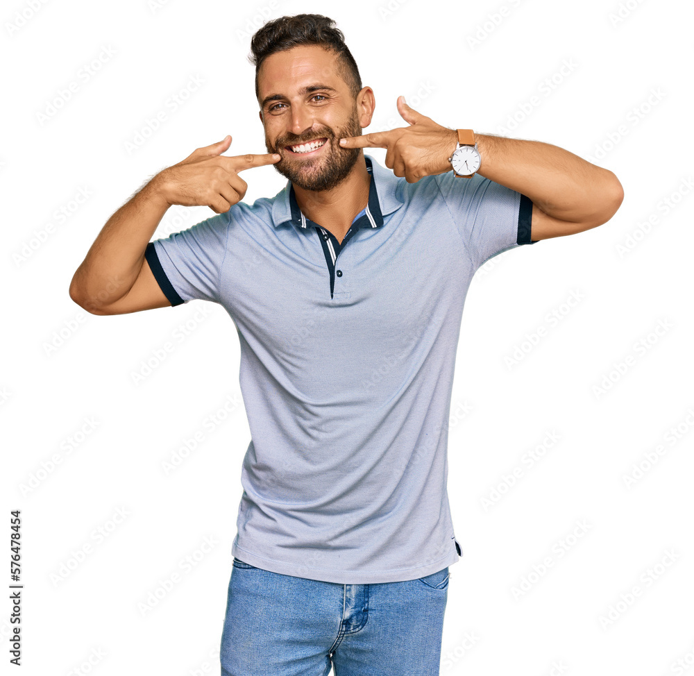 Handsome man with beard wearing casual clothes smiling cheerful showing and pointing with fingers teeth and mouth. dental health concept. Handsome man with beard wearing casual clothes smiling cheerful showing and pointing with fingers teeth and mouth. dental health concept.