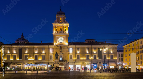 Illuminated building of Parma City Hall in twilight, Italy