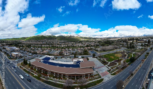 A Snowy Day in the Mountains looking at Yucaipa, California, and the City Hall with Snowy Mountains in the background photo