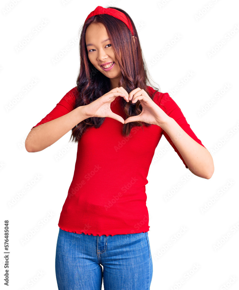 Young beautiful chinese girl wearing casual clothes and diadem smiling in love showing heart symbol and shape with hands. romantic concept. Young beautiful chinese girl wearing casual clothes and diadem smiling in love showing heart symbol and shape with hands. romantic concept.