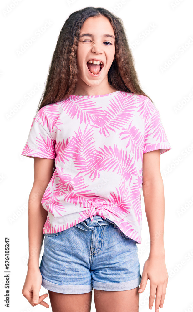 Obraz premium Cute hispanic child girl wearing casual clothes winking looking at the camera with sexy expression, cheerful and happy face.