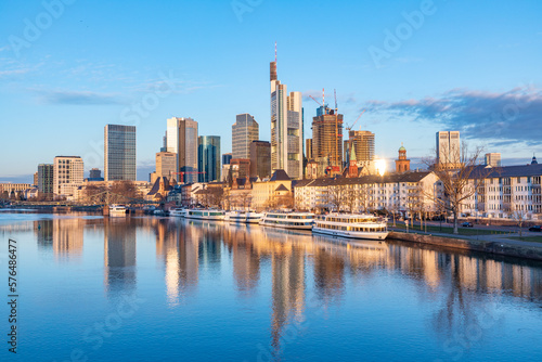 scenic view to skyline of Frankfurt am Main with reflection of the skyline in river Main. © travelview