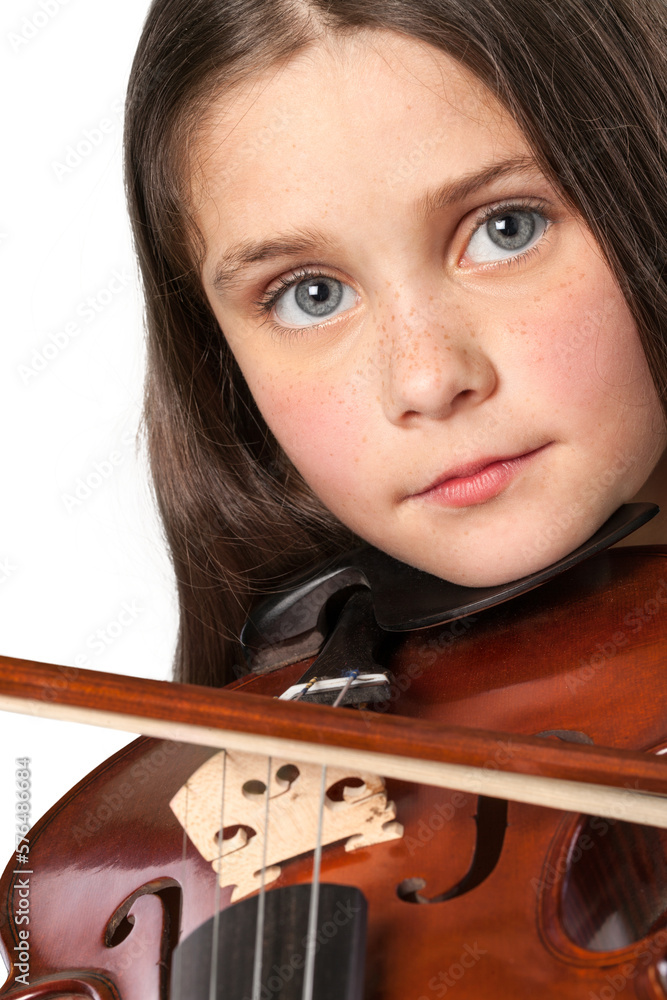A young child with classical musical instrument violin A young child with classical musical instrument violin