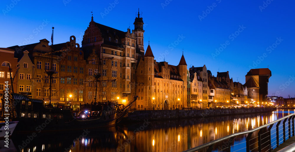 Night view of lighted Motlawa embankment in Polish city of Gdansk .