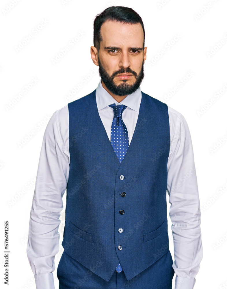 Young man with beard wearing business vest skeptic and nervous, frowning upset because of problem. negative person. Young man with beard wearing business vest skeptic and nervous, frowning upset because of problem. negative person.