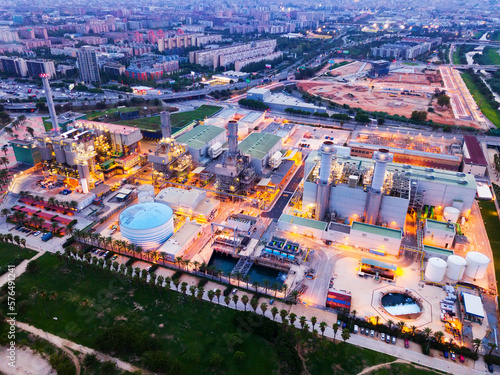 Aerial view of illuminated power plant and garbage processing plant in Barcelona at night ..