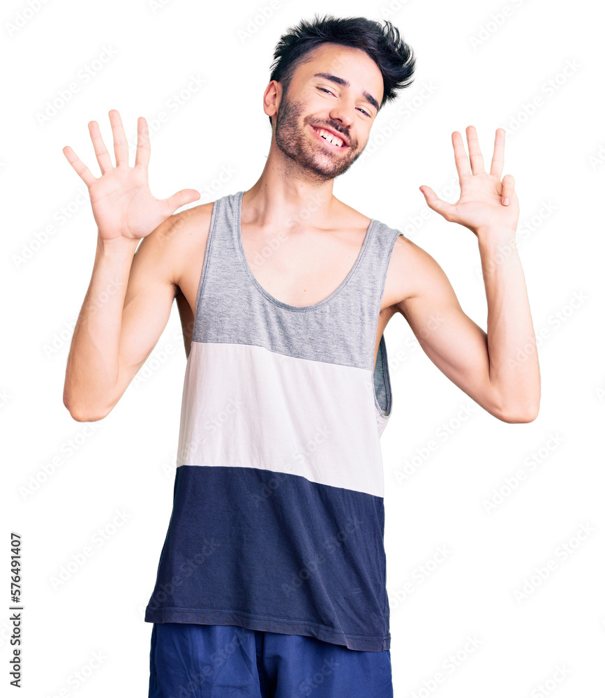 Young hispanic man wearing casual clothes showing and pointing up with fingers number nine while smiling confident and happy. Young hispanic man wearing casual clothes showing and pointing up with fingers number nine while smiling confident and happy.