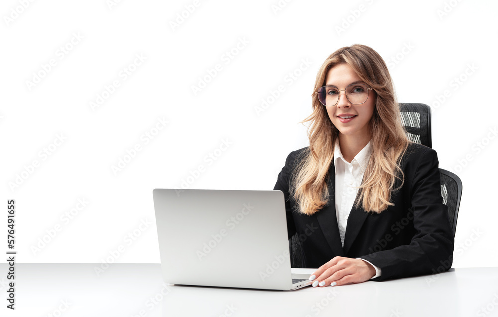 Young business woman or office worker sitting in an armchair behind a desk with a laptop, wearing a black suit and isolated over a white background.business woman while working on a laptop. Isolated
Young business woman or office worker sitting in an armchair behind a desk with a laptop, wearing a black suit and isolated over a white background.business woman while working on a laptop. Isolated