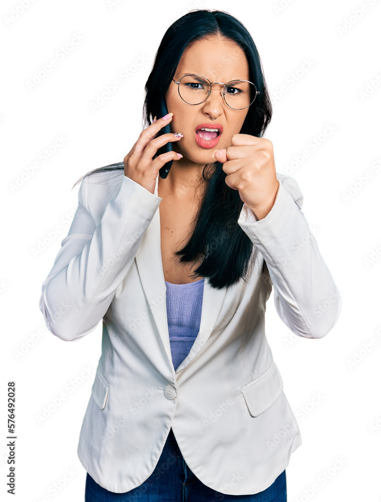 Beautiful hispanic woman with nose piercing having conversation talking on the smartphone annoyed and frustrated shouting with anger, yelling crazy with anger and hand raised Beautiful hispanic woman with nose piercing having conversation talking on the smartphone annoyed and frustrated shouting with anger, yelling crazy with anger and hand raised
