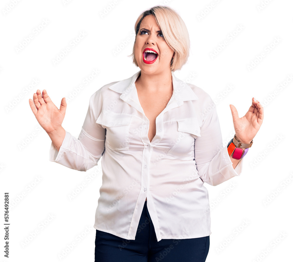 Young blonde plus size woman wearing casual shirt crazy and mad shouting and yelling with aggressive expression and arms raised. frustration concept. Young blonde plus size woman wearing casual shirt crazy and mad shouting and yelling with aggressive expression and arms raised. frustration concept.