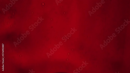 Streaks of blood pouring on a white surface
