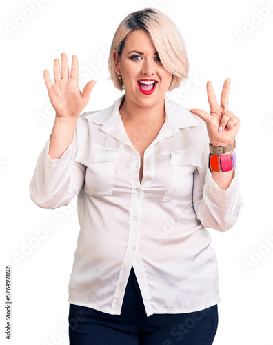 Young blonde plus size woman wearing casual shirt showing and pointing up with fingers number eight while smiling confident and happy.