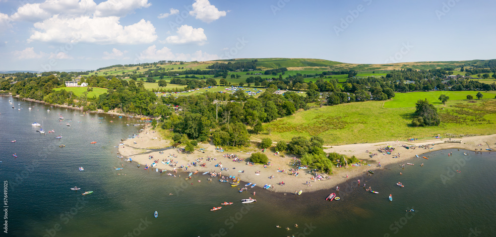 Crowds of people on a small lakeside beach in the middle of summer (Ullswater, Lake District, England) Crowds of people on a small lakeside beach in the middle of summer (Ullswater, Lake District, England)
