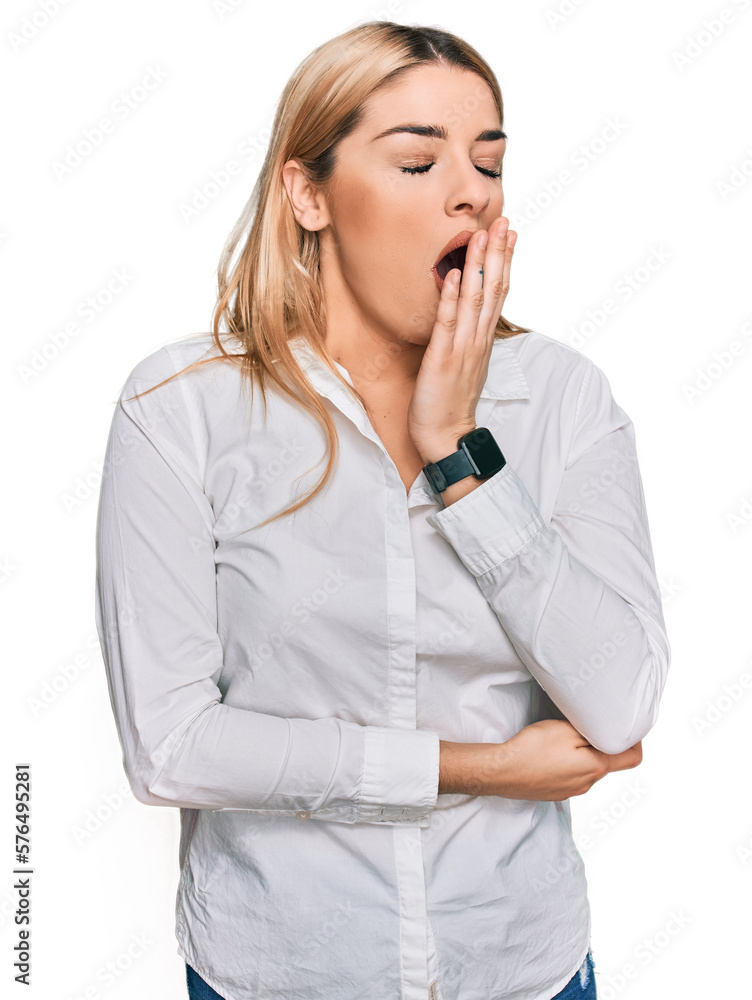 Young caucasian woman wearing casual clothes bored yawning tired covering mouth with hand. restless and sleepiness. Young caucasian woman wearing casual clothes bored yawning tired covering mouth with hand. restless and sleepiness.