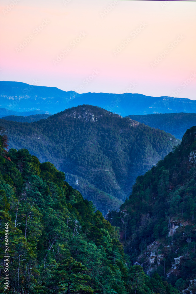 sunset in mountains with sky of colors and blue mountains, sierra madre occidental in mexiquillo durango 