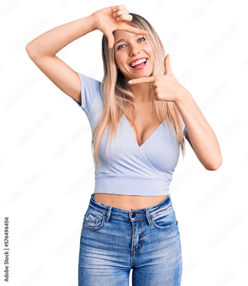 Young beautiful blonde woman wearing casual clothes smiling making frame with hands and fingers with happy face. creativity and photography concept. Young beautiful blonde woman wearing casual clothes smiling making frame with hands and fingers with happy face. creativity and photography concept.